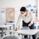 Teacher wiping down desks