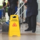 Workers mopping floors of commercial building